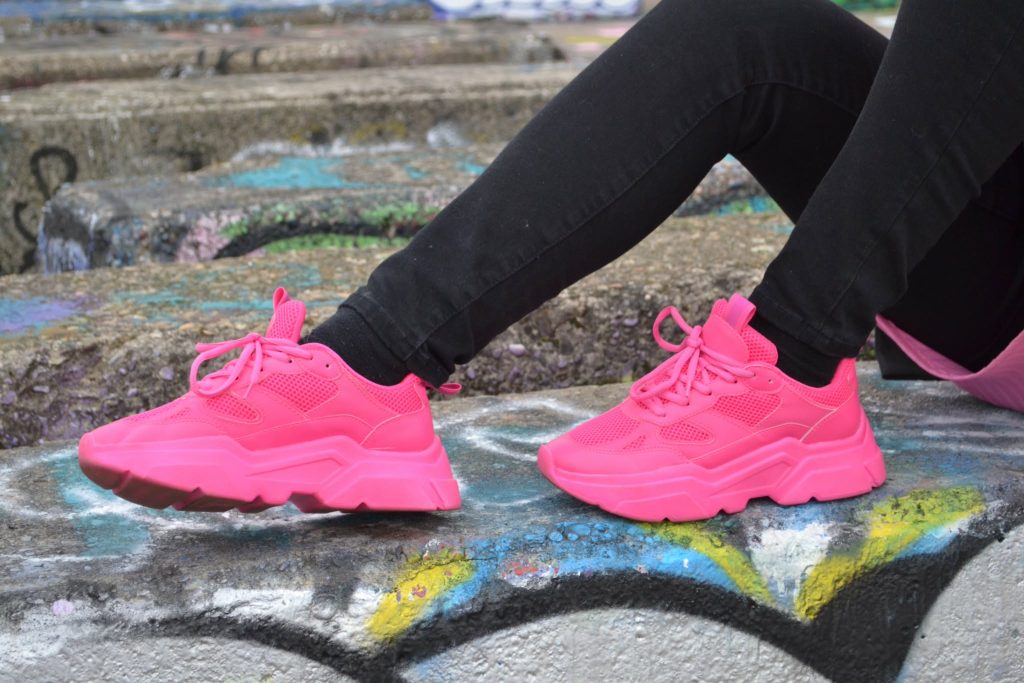 a girl is wear pink shows 