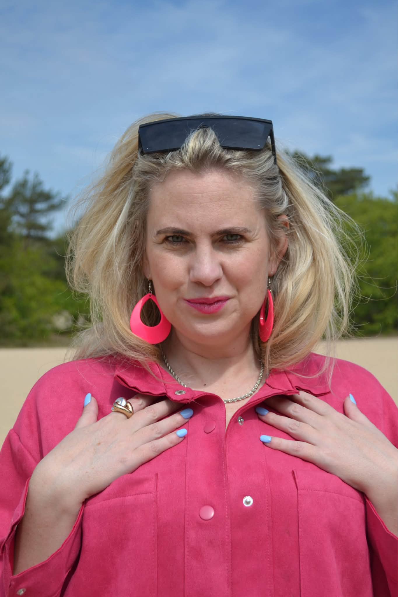 Styling A Baggy Jeans With Buffalo Boots And Some Feminine Pink Jacket and Jewelry.